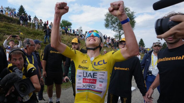 Pogacar launches late attack to win 14th stage, build on Tour de France lead